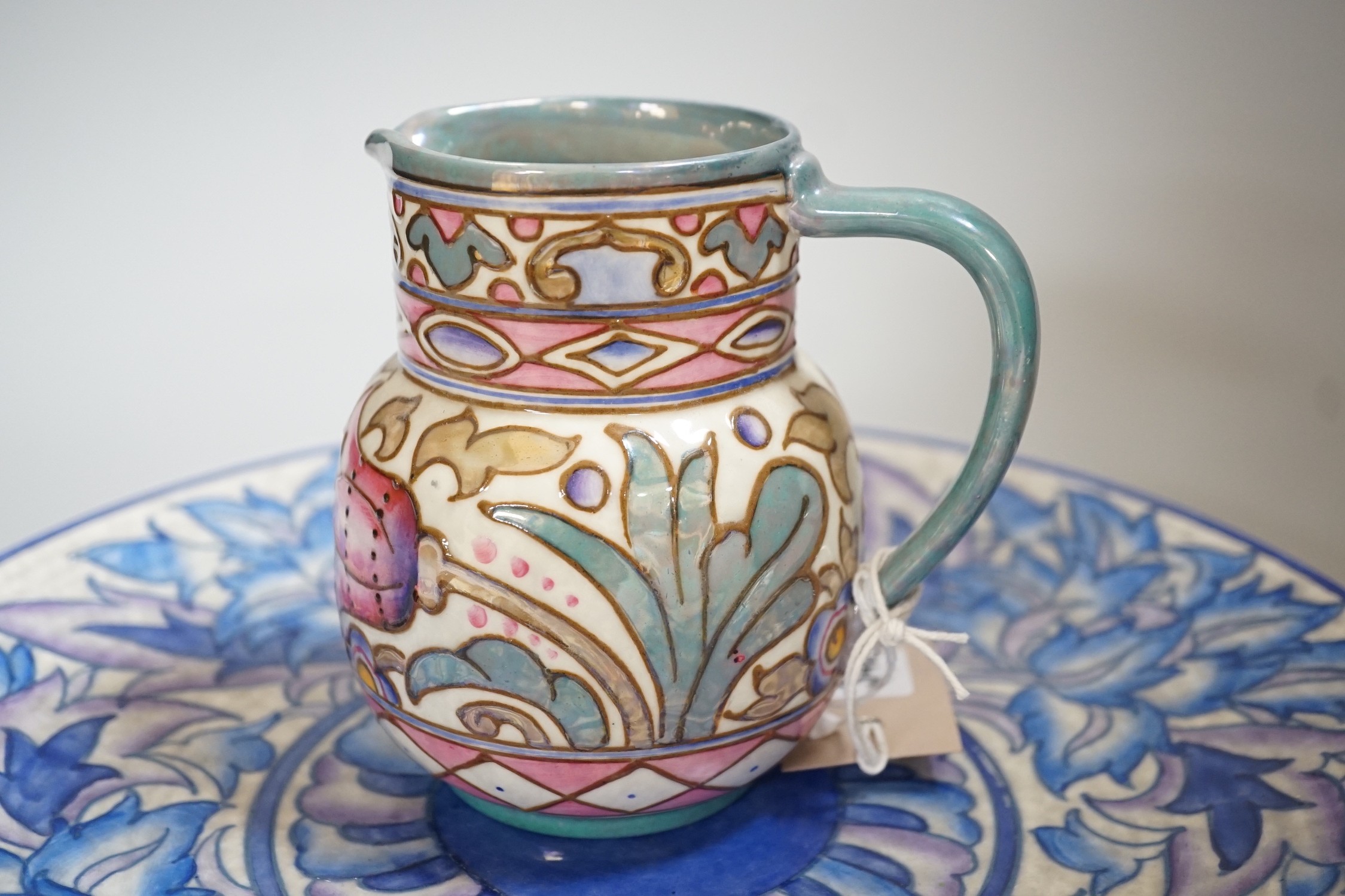 A Burleigh ware Charlotte Rhead lustre jug and a Crown Ducal dish, diameter 32cm